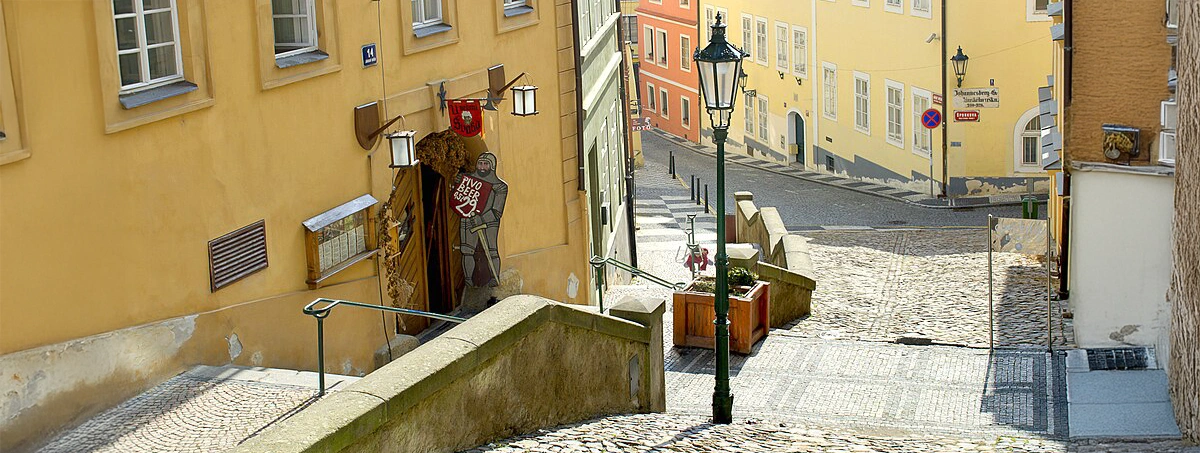 This image shows the historic Jánský vršek street in the Malá Strana district of Prague, Czech Republic